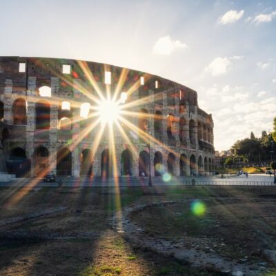 roma 001 Morning view with sun beams of the Colosseum in the beautiful warm light after sunrise, Rome, Italy.